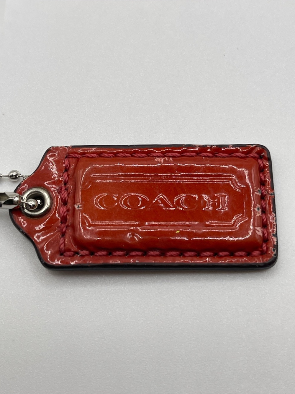 Coach Red Patent Leather Hang Tag With Embossed Logo